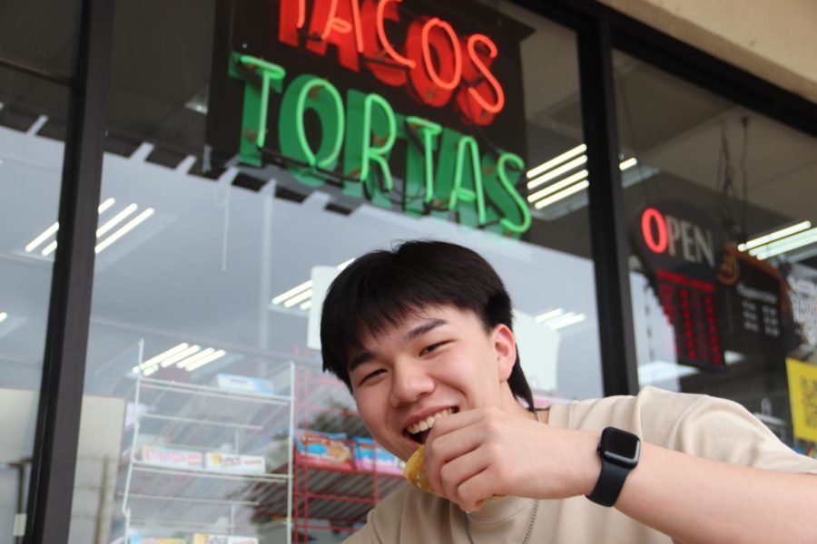 Coppell+High+School+senior+William+Li+eats+a+Mexican+Street+Taco+from+Speedy+K+Gas+Station+on+the+intersection+of+Sandy+Lake+Road+and+Moore+Road+on+Friday.+Li+enjoys+trying+cultural+cuisines+as+a+vessel+to+experience+new+cultures.