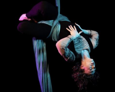 Senior Cole Thompson began learning aerial silk performance at age 14. In this photo, they performed in a showcase to Goldfrapp’s “Lovely Head.” “I love silks because it’s death defying,” Thompson said. “It looks dangerous and impossible, and that’s beautiful to me.”