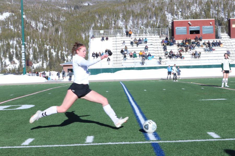 Sophomore Charlotte Hood strikes at the ball. Hood is a part time keeper for JV and a field player. She leads the team in goals per match and shots. 