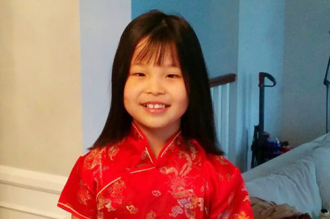 At 9 years old, I wear a qipao in preparation for Lunar New Year. Even if Asian Americans relationship to their culture is complicated, stigma surrounding assimilation is ignorant and unjustified.