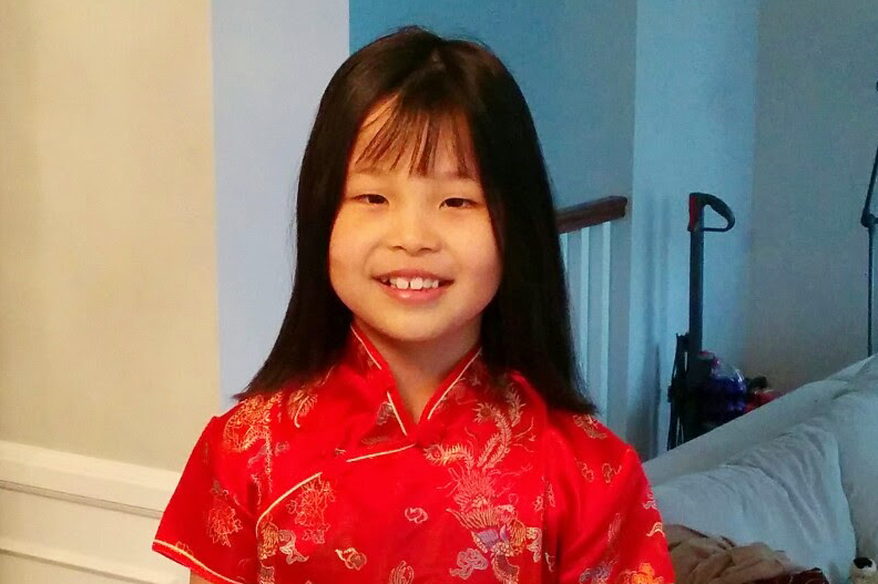At 9 years old, I wear a qipao in preparation for Lunar New Year. Even if Asian Americans relationship to their culture is complicated, stigma surrounding assimilation is ignorant and unjustified.