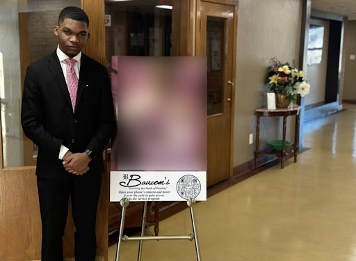 Senior Terrence Clark presides over a funeral at Baucom's Life Celebration Center.  Clark is a funeral attendant, and plans on earning his degree so that he can become a mortician. (Photo edited for privacy of family at funeral)