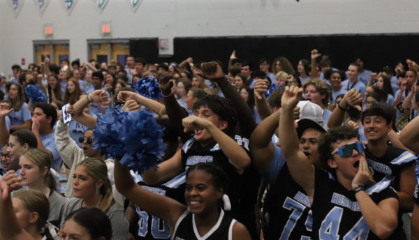 Students boo during a 2022 indoor pep rally. According to the School-Sponsored Events and Activities bill, parent permission forms will now be required for students to attend such events.