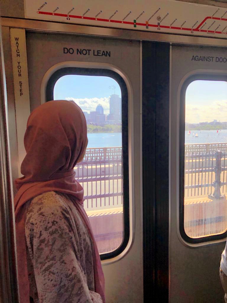 An image of Sabira Khalili on a train, in Boston