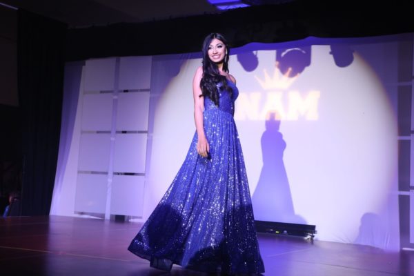 Sophomore Riti Patels modeling dreams become a reality as she struts across stage during her formal wear event.