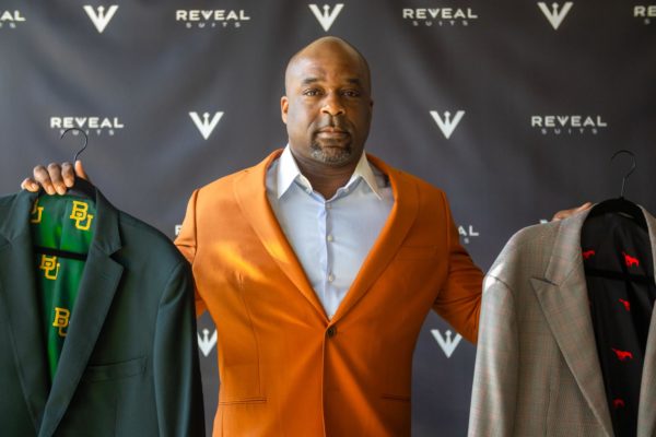 DUAL THREAT Dixon displays two of his intricate college suit designs, one for SMU and one for Baylor.