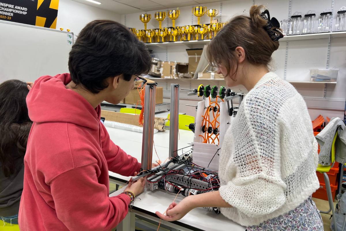 Members of the robotics team assemble their robot for the FIRST Global Challenge Sept. 27. A selected team of 10 students will travel to Singapore Oct. 5-12 to represent Great Britain in the international competition. 
