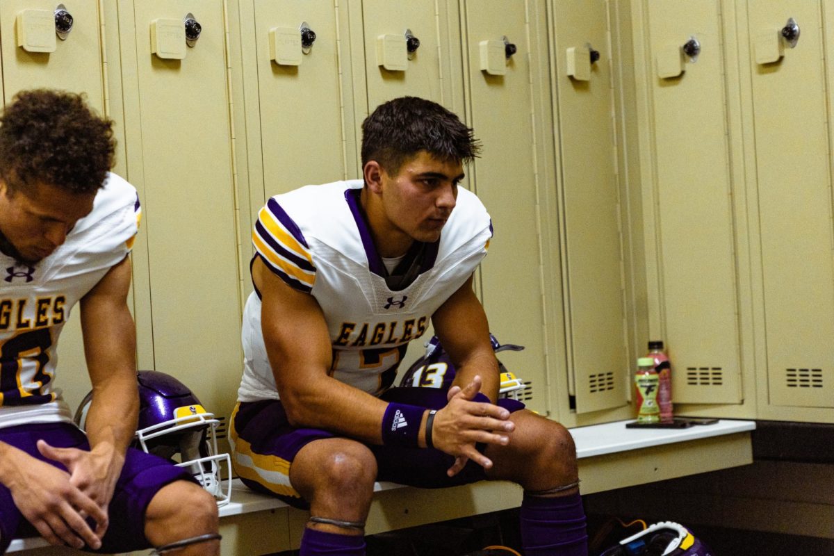 Eagle wideout Tony Pannunzio sits in the locker room prior to a game.