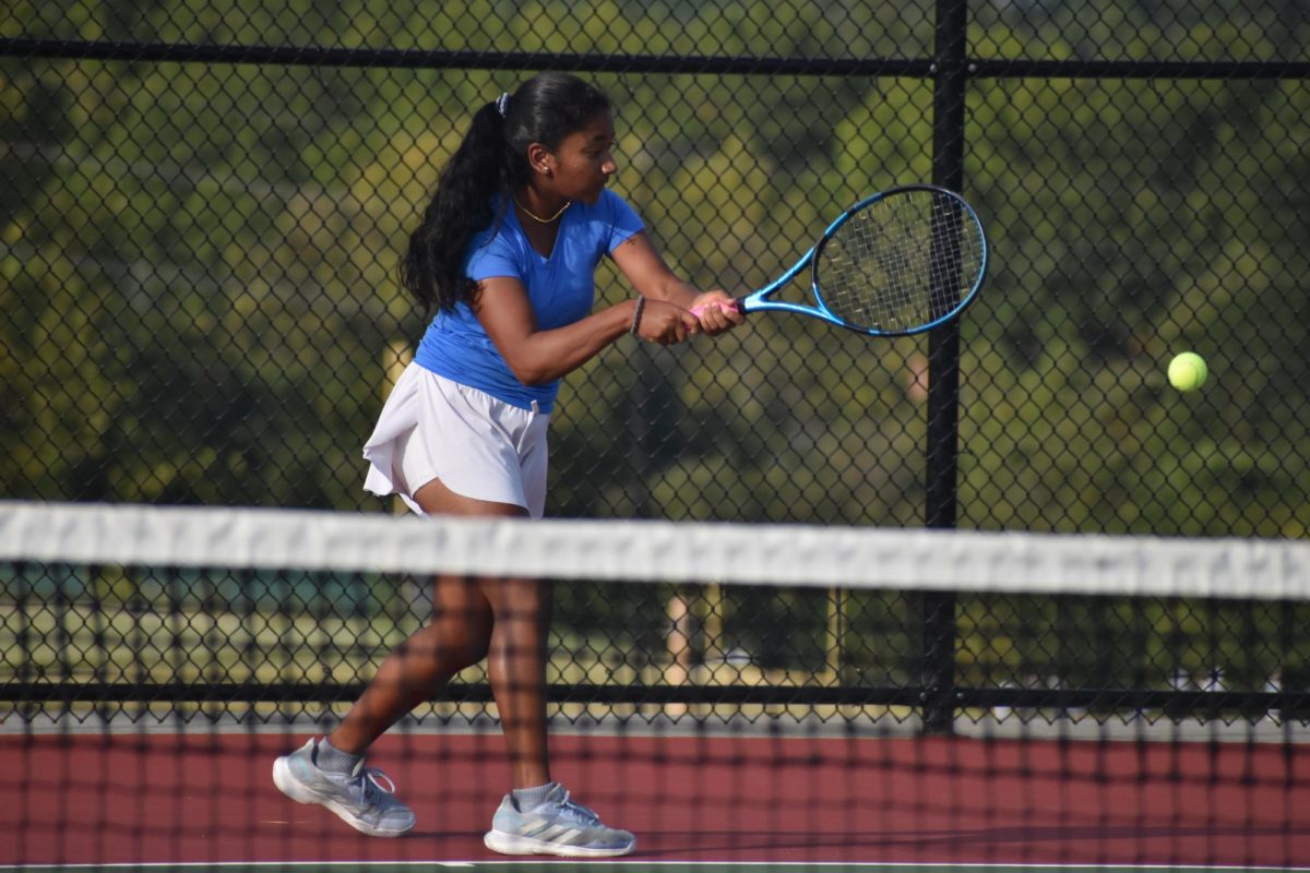 Staying on her toes, freshman Mireya David hits a backhand shot as she stays driven towards the ball. Being new to the girls tennis team, David appreciates the veterans of the team for welcoming her with open arms. “The team already had a really good bond when I first came. I was really grateful for how accepting the girls were of me on the team. They really made me feel welcome when I first arrived,” David said.