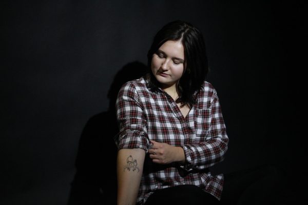 Samantha Wurm shows a tattoo she got in April in remembrance of her father who passed away Jan. 13. The scene depicts one of Wurm’s favorite memories with her father, Tony as they overlook Lake Superior’s North Shore in Grand Marais, MN in Sept. 2012. 