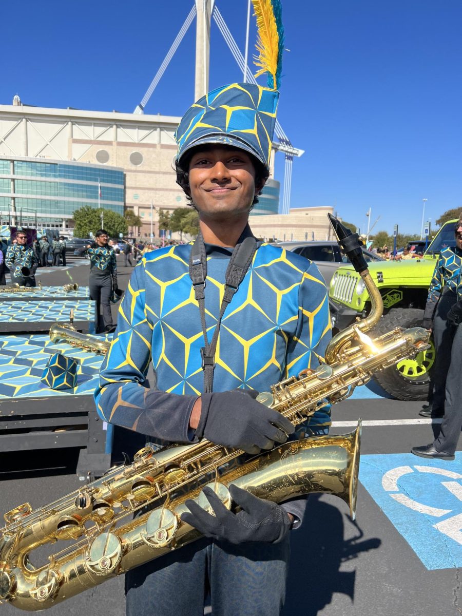 Coppell+High+School+senior+Rishi+Dasari+holds+his+barry+saxophone+after+playing+for+Coppell+Band+in+the+UIL+State+Competition+at+Alamodome+in+San+Antonio+on+Oct.+31.+Dasari+is+a+varsity+saxophone+section+leader+for+Coppell+Band%2C+a+Red+Jacket+and+Coppell+Mock+Trial+president%2C+holding+the+aspiration+of+pursuing+law+in+the+future.+Photo+courtesy+Rishi+Dasari.