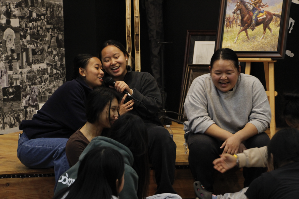 Tu Lor Eh Paw and other teenage girls sing Bruno Mars’ “Grenade” during karaoke at Urban Village Klub after a fun-filled evening of food and playing “Minute to Win It” games at The Urban Village Nov. 9. “[The Urban Village’s] focus is to accompany K’nyaw and Karenni youth as they connect, heal and launch,” co-founder Jesse Phenow said.