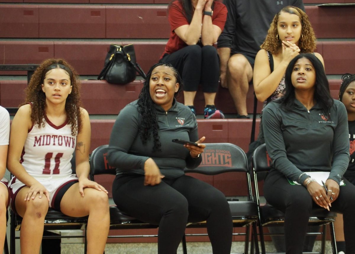 Assistant+coach+Khaalidah+Miller+%28left%29+with+assistant+coach+ONeisha+Smith+%28right%29+instructing+from+the+sidelines+during+varsity+girls+basketballs+season+opener+against+Mt.+Paran.+The+Knights+suffered+a+tough+loss%2C+ending+43-65.