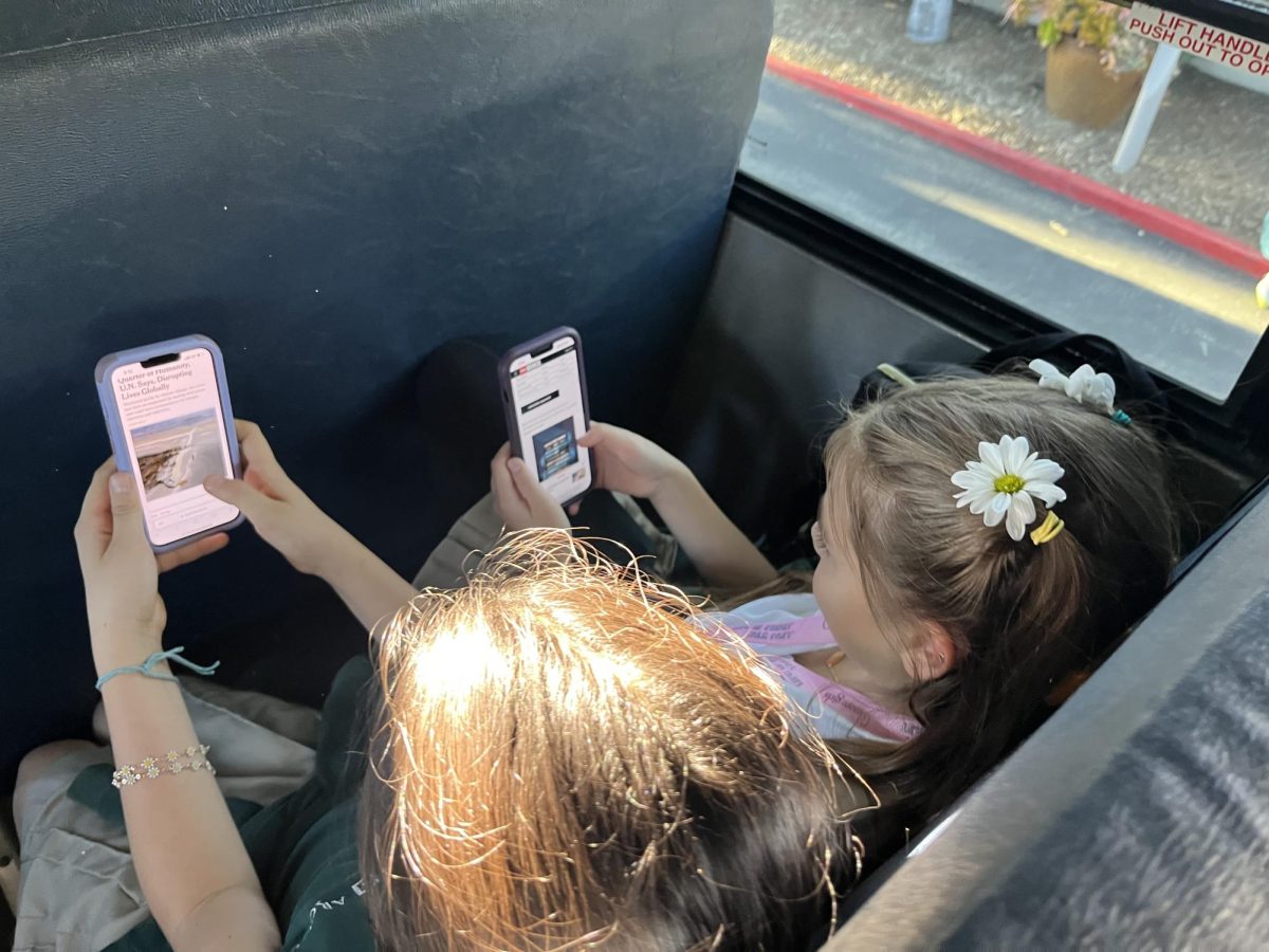 Students read articles on The New York Times and The Washington Post on the bus ride to school. News deserts, a term used to describe communities without a source of local news, often leave people to rely on national outlets that dont feature their communitys stories.