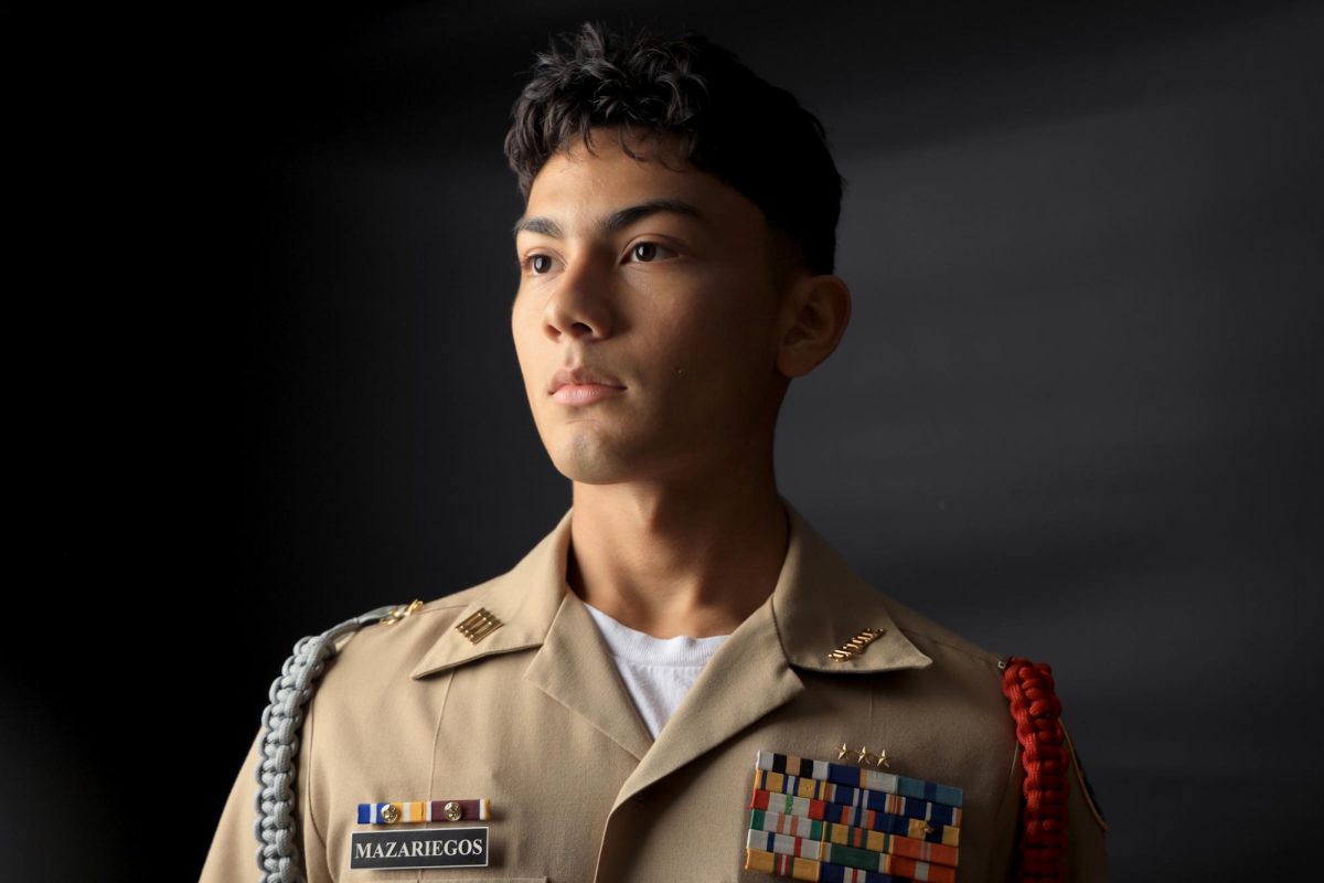 CARPE+DIEM.+Senior+Cristian+Mazariegos+takes+his+attention+stand+from+JROTC+to+pose+during+a+magazine+photoshoot+on+Wednesday%2C+Sept.+27.+Over+the+summer+Mazariegos+attended+a+Naval+Academy+seminar+that+gave+him+the+chance+to+grow+his+passion+for+the+navy.+Summer+seminar+is+a+chance+to+know+what+life+is+like+at+campus+where+they+did+physical+training%2C+workouts%2C+and+attended+academic+sessions+according+to+their+majors.+%E2%80%9CHey+if+I%E2%80%99m+good+for+the+Academy%2C+imagine+what+else+I%E2%80%99m+good+enough+for%3F%E2%80%9D+Mazariegos+said.+%E2%80%9CIt+made+me+realize+that+you+really+just+got+to+take+the+risk%2C+take+the+opportunity+and+seize+the+day.%E2%80%9D+