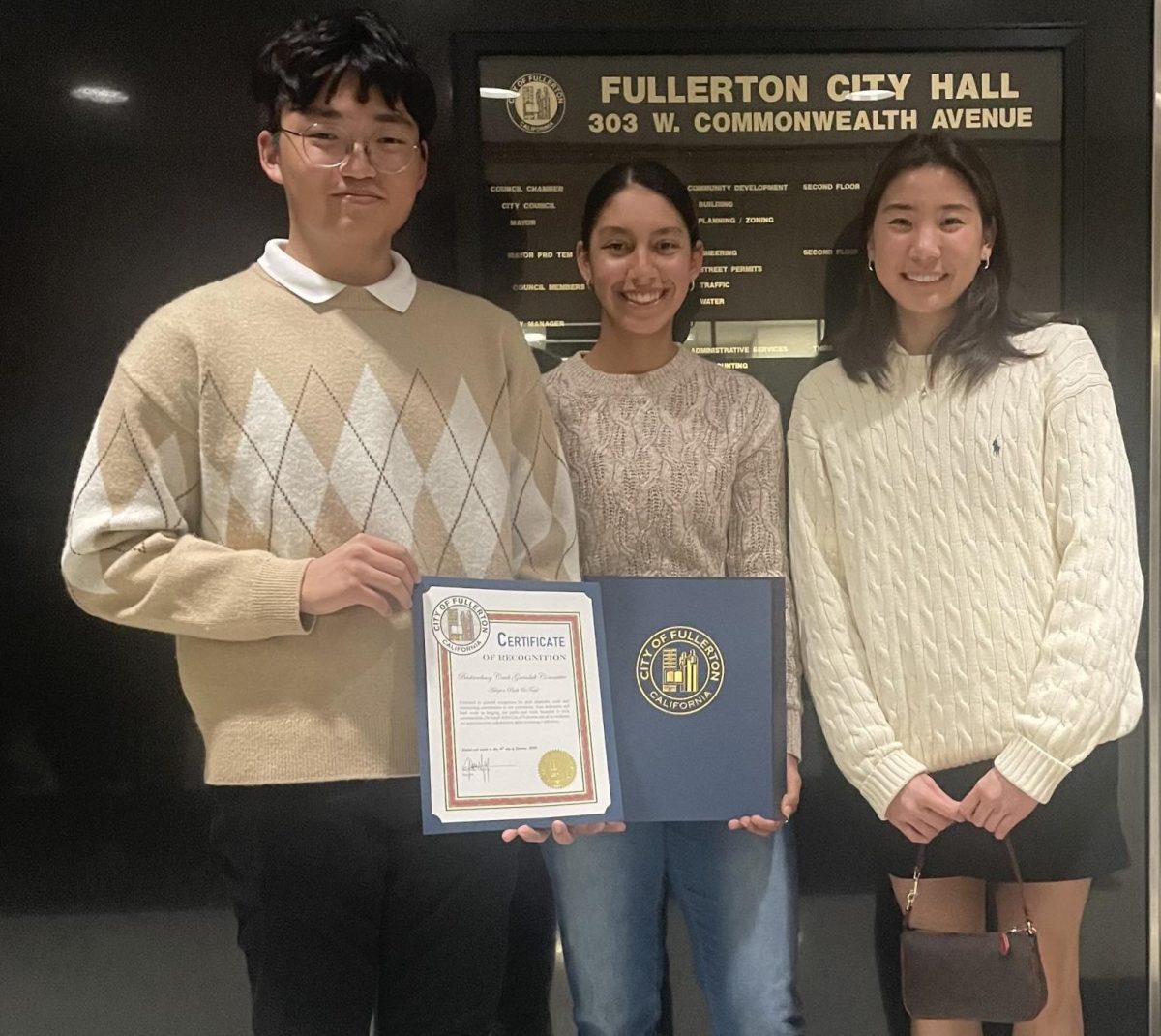 Girls tennis player junior Daniela Borruel (center) received her certificate of recognition alongside her two Sunny Hills classmates, who were also in attendance to receive their own certificates for being Adopt-A-Park volunteers, from the Fullerton City Council in City Hall on Tuesday, Jan. 16.