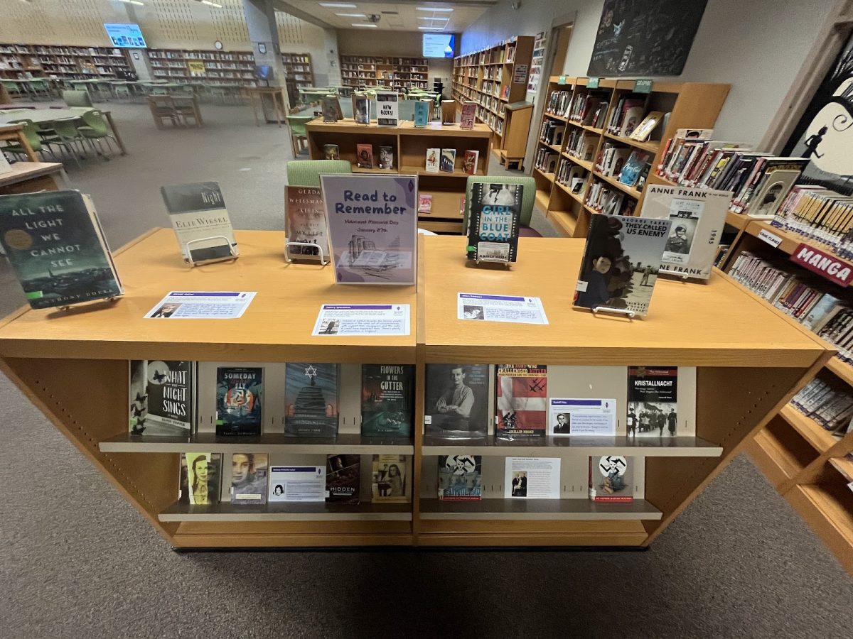 Ms.+Diorio+helped+set+up+a+display+in+the+library+with+a+variety+of+books+relevant+to+both+World+War+II+and+the+Holocaust.