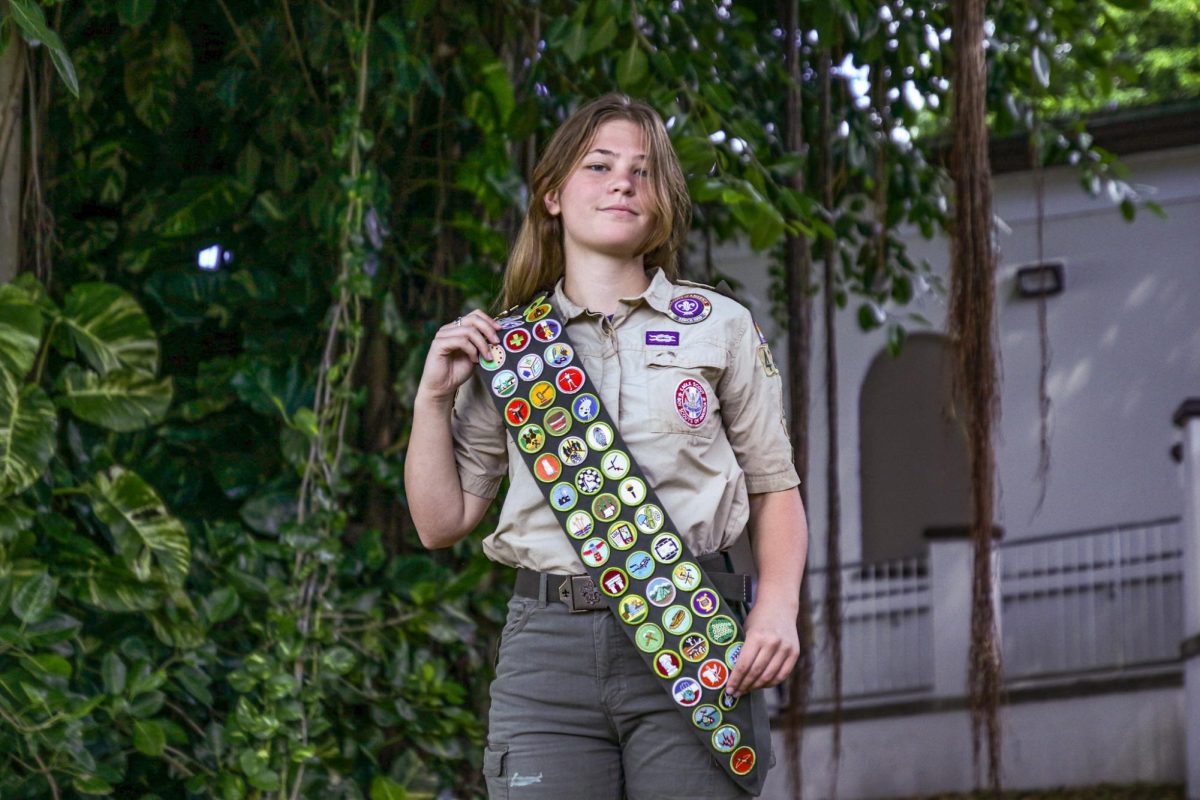 Communications+junior+Lily+Kaminski+poses+in+her+uniform+on+Freshman+Hill.+Kaminski+has+earned+53+merit+badges+along+with+the+rank+of+%E2%80%9CEagle+Scout%2C+the+highest+possible+rank+in+Scouts+BSA.+++