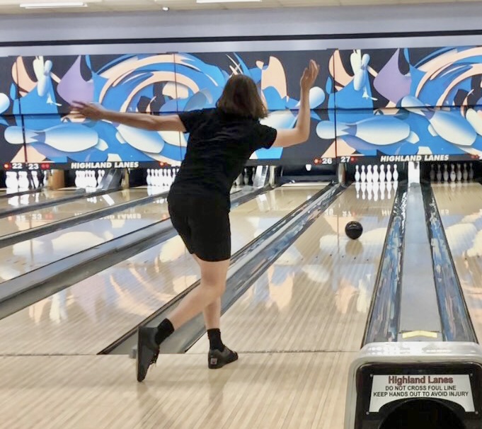 Coda Becker practices with his father at Highland Lanes. Despite his relative inexperience, Becker has already taken strides to becoming an elite bowler.