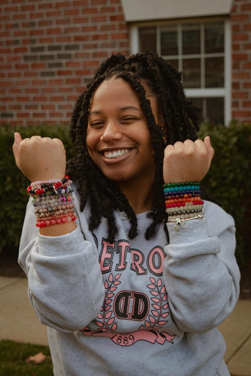 Sophomore+business+administration+major+August+Jackson+shows+off+her+beads.