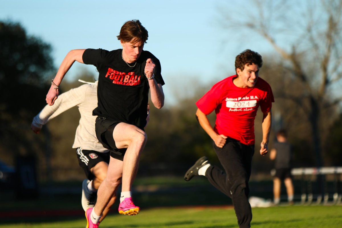 THE MAD DASH: Junior Owen Langdon practices sprints, during track practice. Racing against fellow sprinters Langdon starts off strong. 
