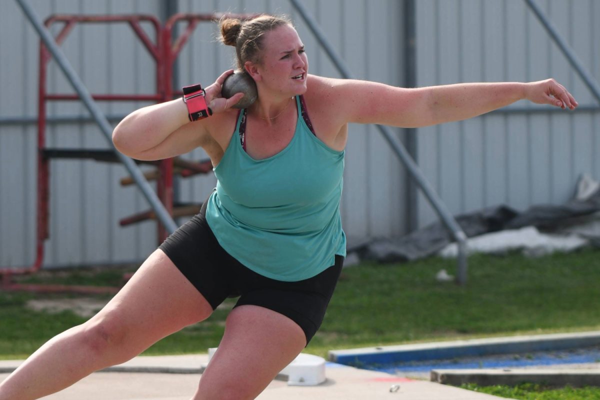 Junior+Courtney+Daniel+practices+throwing+the+shot+put+after+school.+She+is+among+the+top-ranked+throwers+in+the+nation.