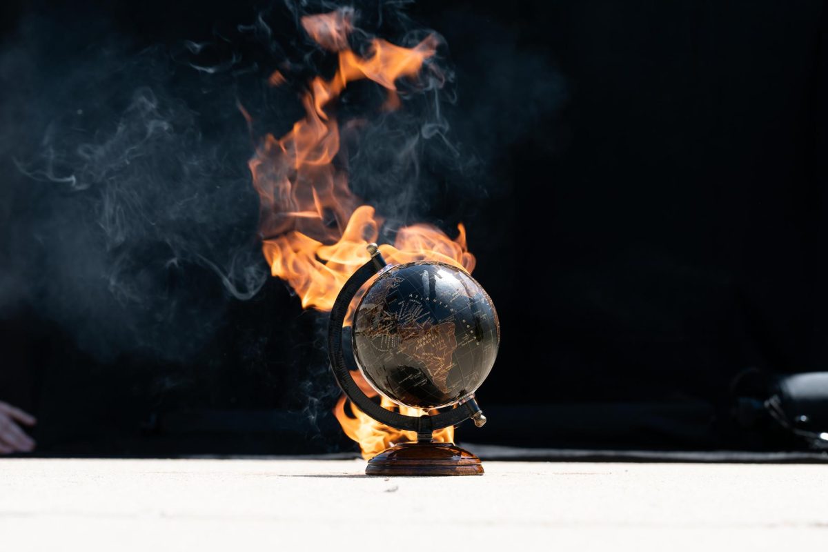 A+globe+on+fire%2C+symbolizing+climate+changes+effects.