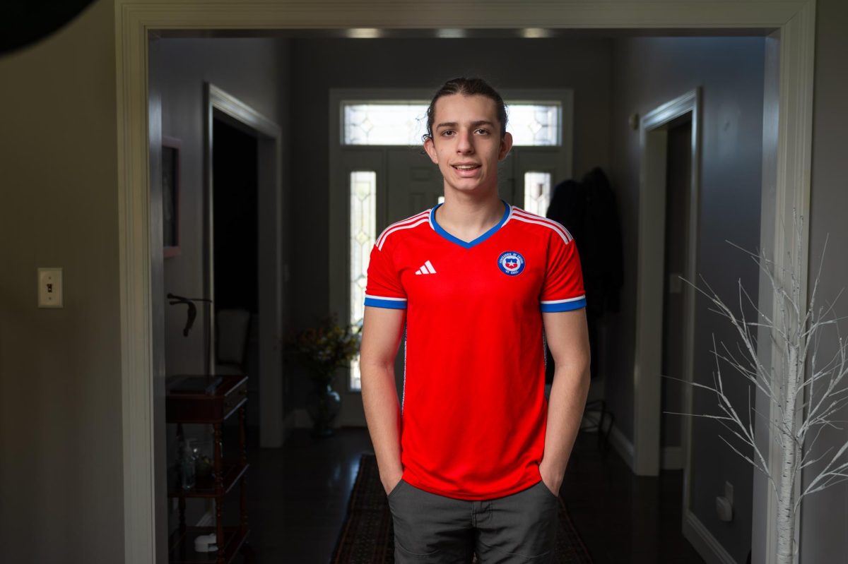 Junior Eduardo Naranjo dons a Chilean soccer jersey. He watched soccer games often with his family. Whenever the Chilean team was playing in a World Cup match, we would watch it, Eduardo said. 
