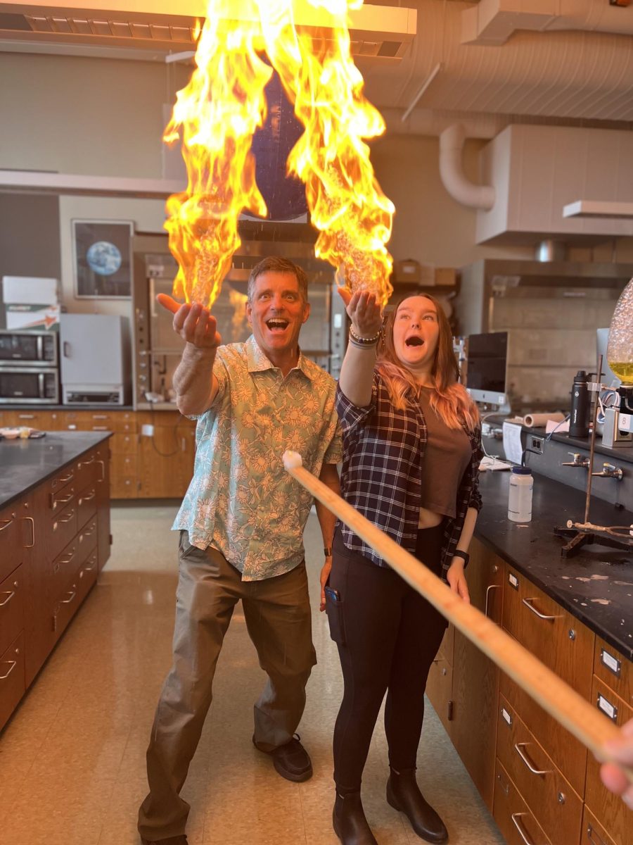 Science Department Head Nathan Peck conducts a fire bubble experiement with junior Hannah Yurkovich. This is an experiment about energy, heat, pressure, states of matter, chemical reactions and water.