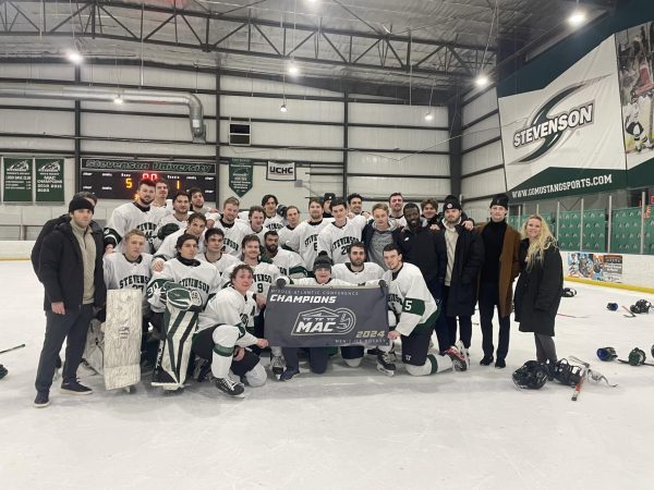 Mens ice hockey poses after capturing second consecutive MAC title