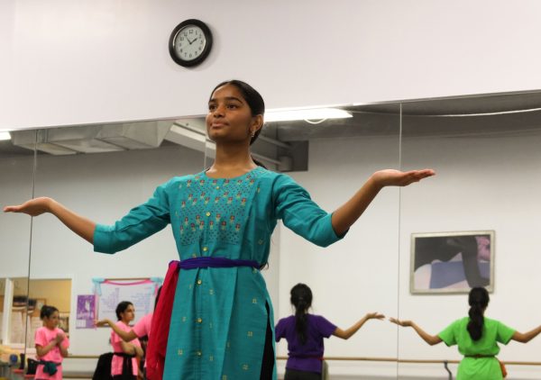 Sophomore Sahasra Mandalapu practices bharatanatyam choreography in class. These new dances will be performed in an annual show in February. Mandalapu found that practicing in class helped her overcome stage fright during her performances. “When [I] get on stage, Im nervous Im going to forget, even though Ive done it for so long,” Mandalapu said. “Theres still that little bit of stage fright [when] I second-guess myself that I dont know it enough, but I do because Ive been practicing for a whole year.”