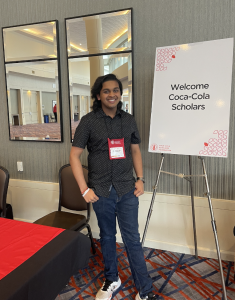 As a Coca-Cola Scholar, senior Eshaan Mani was invited to Atlanta to participate in a weekend-long celebration and leadership development program. Mani poses wearing his Coca-Cola lanyard by the welcome sign in the Hilton Atlanta Airport, which was the main site of the weekend. 

“Most of the leadership development, games, and team building activities were held in the ballroom of the Hilton,” Mani said. “The only events outside the hotel were the opening banquet at the Georgia International Convention Center, a tour of the Center for Civil Rights and World of Coca-Cola and the final party at Coke headquarters.”