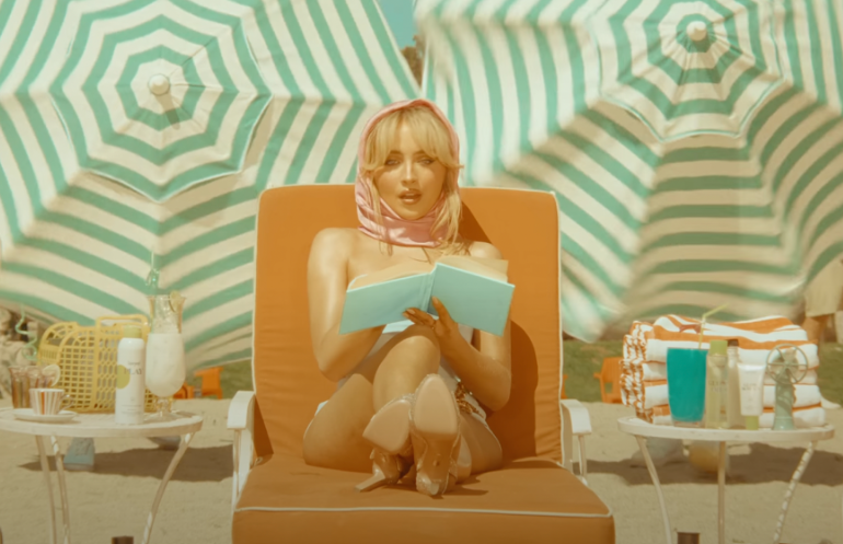 In the “Espresso” music video, Sabrina Carpenter relaxes at a beach.