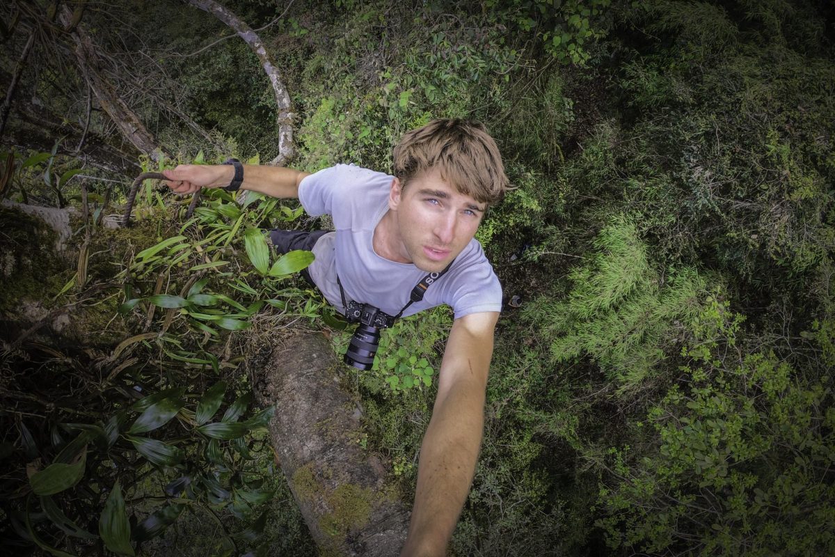 Class of 2010 graduate and conservation photographer Kyle Obermann takes a self portrait photo while on a shoot.