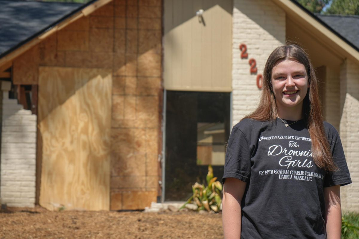 Junior Maebeth Potter stands outside her home two months after Hurricane Beryl uprooted a tree in the Potters' front yard. The tree split the house in half. The home is in the midst of being rebuilt.