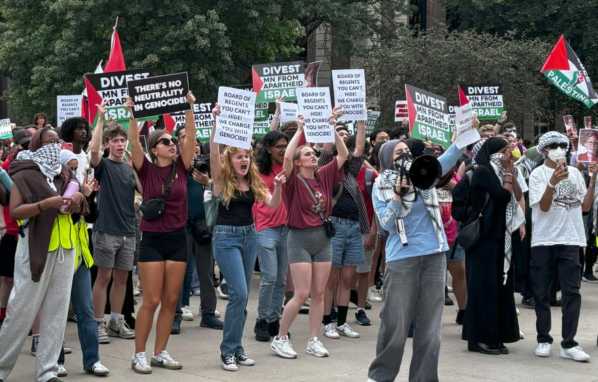 Protestors silenced Cunningham’s inaugural speech for over four minutes as members of staff struggled to contain activists in Northrop Hall.