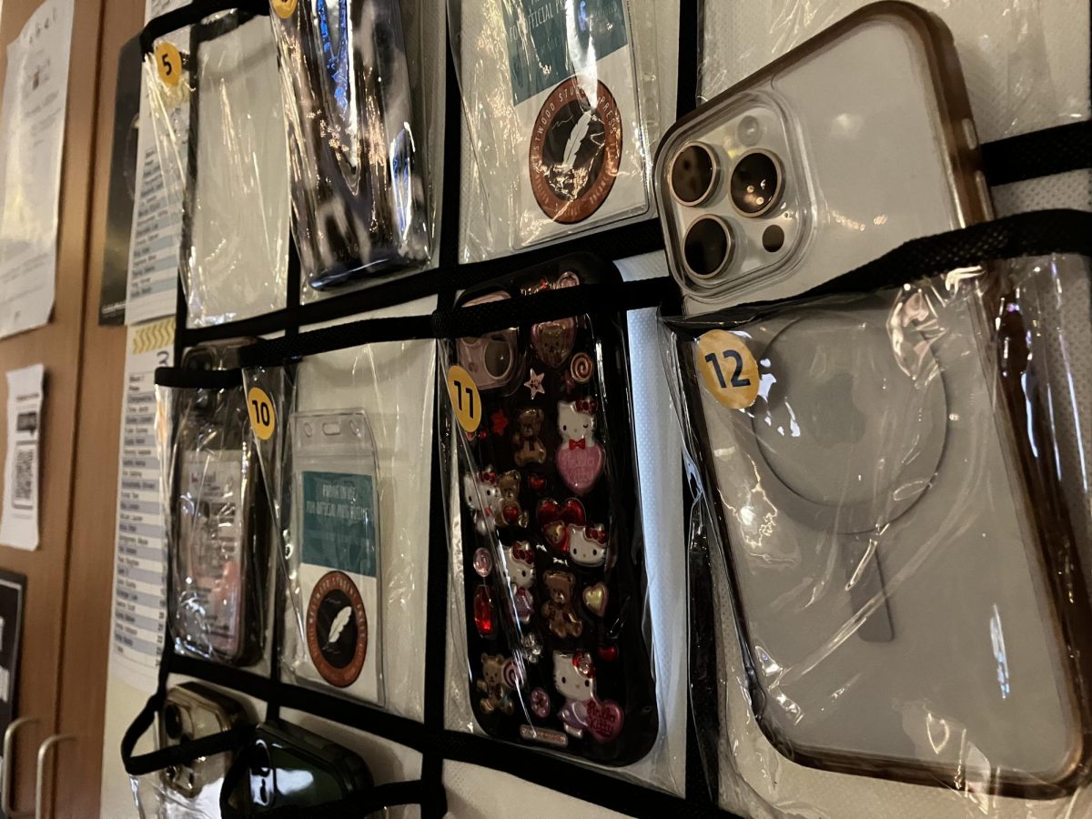 Students' phones in a phone storage caddy during class. At the start of the 2024-2025 school year,  the Westwood administration introduced a new policy restricting phone use in class. Restricting phone use to set times in the school day, the new policy has been met with both approval and annoyance.