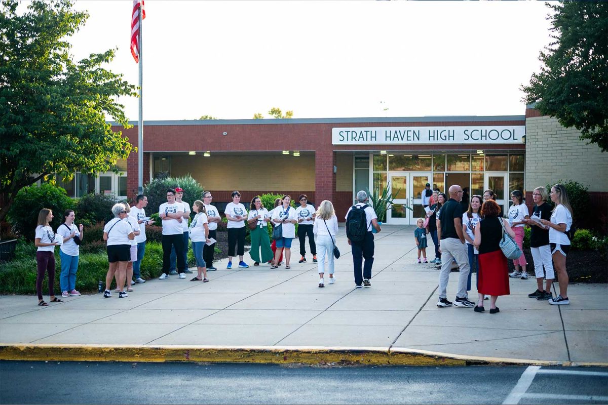 WES TEACHERS SHOW SUPPORT • Teachers from Wallingford Elementary School line up at the high school entrance at the September 5 back-to-school night to distribute fliers and speak with families in support of a contract for teachers. There has been a teacher presence at each school’s back-to-school night.   