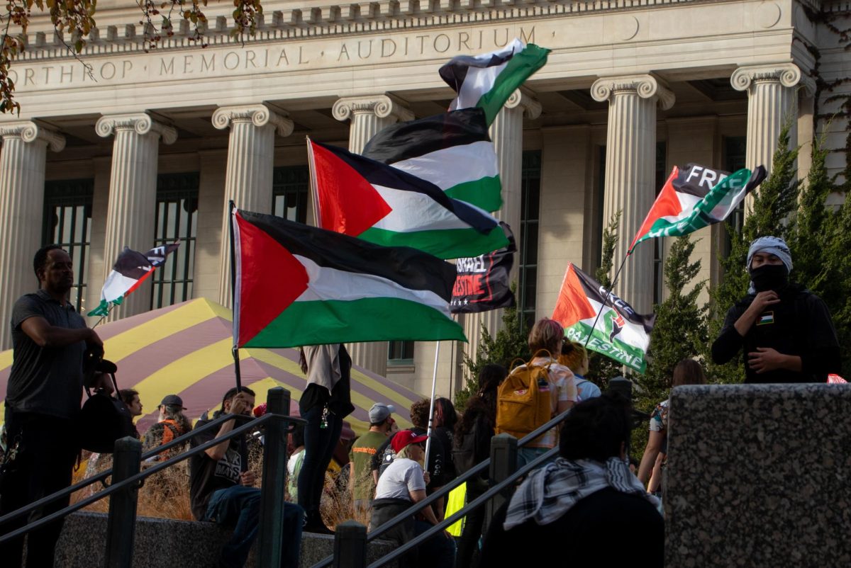 Protesters gathered outside of the building entrances while some demonstrators moved chairs and tables in front of the doors.