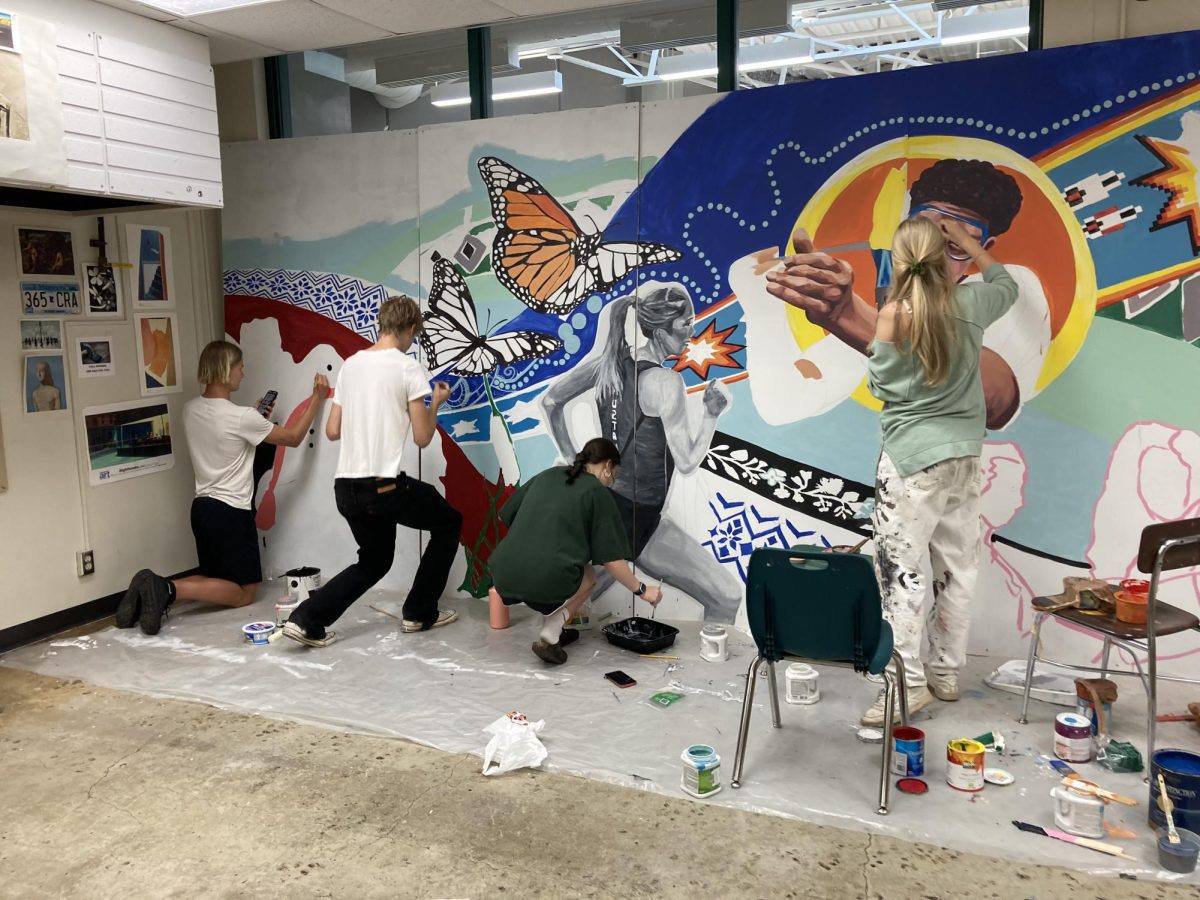 Students gathered over the summer to paint mural.