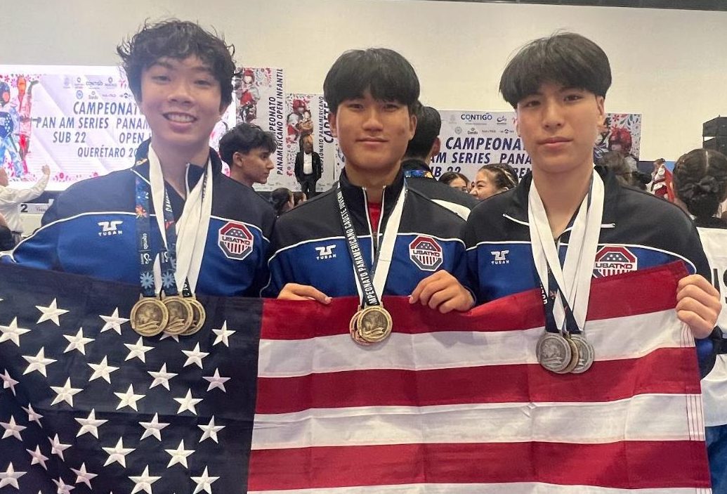 Junior Mikel Cho (right) celebrates with his teammates at the 2024 Pan Am Cadet & Junior Taekwondo Championship on Friday, July 26, held at Arteaga Gymnasium in Querétaro, Mexico. Their performance earned the trio the gold medal.