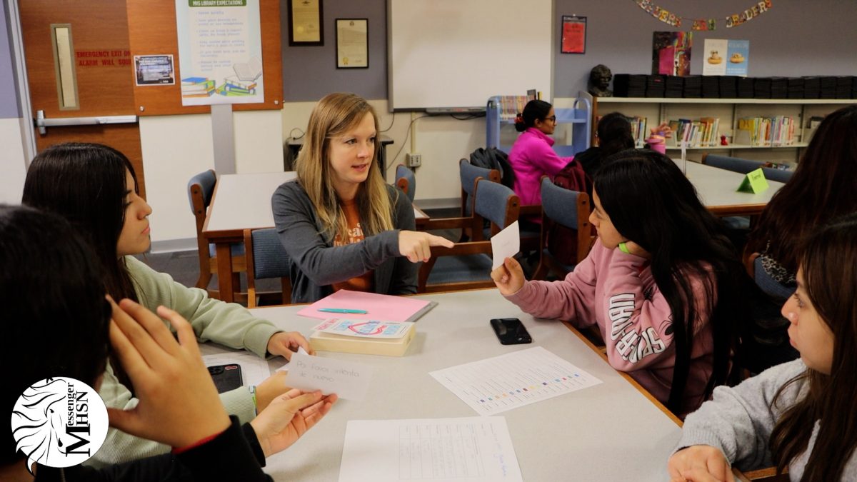 Students in the ESOL program teach the librarians phrases in their home language. Watch the video to learn more about the activity.