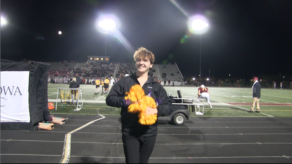 Ankeny High School junior Garrett Hemmingsen poses after his halftime performance at the AHS home football game on Friday Oct. 18, 2024. 

The dance team was at the Iowa State Dance and Drill Team Association's state competition on Dec. 6 and came home with a Division 1 (highest rank) rating in all three dances, third place in class 3 contemporary, and fifth place class 9 in hip hop. Photo still by Amber Eft