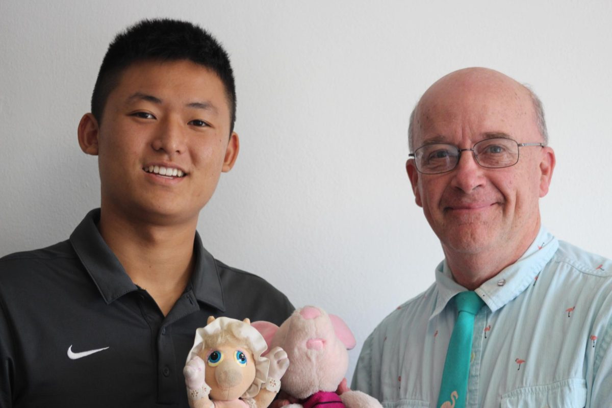 PEMDAS & SADMEP: Senior Oliver Yang and Math Teacher Sean Lieblang pose together for a photo with stuffed animals. Lieblang’s stuffed animals, Pemdas and Sadmep, are two very important aspects of the Chapter 1 curriculum in Algebra 2/Trigonometry. These characters help ensure that the students remember the importance of simple algebra strategies. “Back in my sophomore year, Mr. Lieblang taught us about simplifying expressions and solving equations.” Yang said. “Whenever he spoke of PEMDAS and SADMEP specifically, I always thought about his two stuffed animals.”