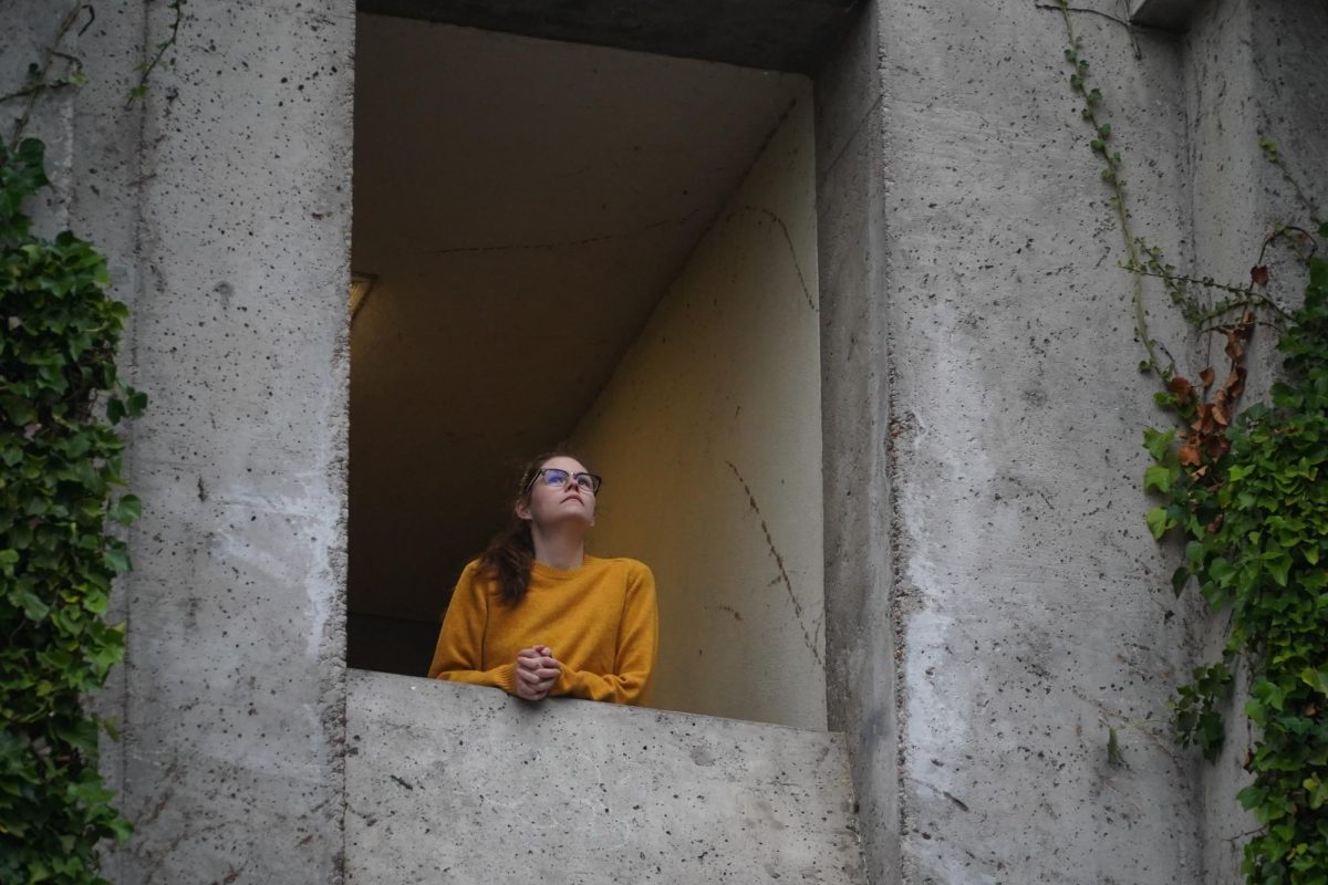 Alaina Ross looks out of Thornton Hall at the sky on Nov. 20, 2024. (Neal Wong / Golden Gate Xpress)