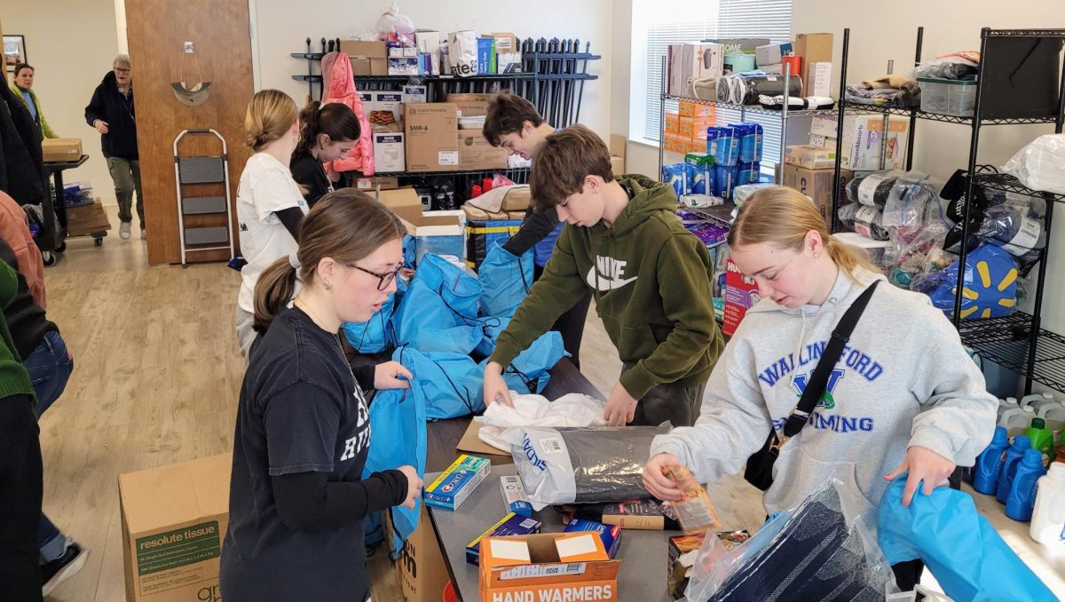 Strath Haven students prepare bags in the ACCESS Center. These bags were given out to people in need at noon.