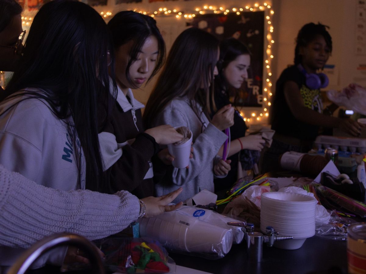 Sophomore Anna Shi works alongside other girls as they create capsules for the egg drop. Girls in STEM hosted the egg drop event on Friday, Nov. 22.