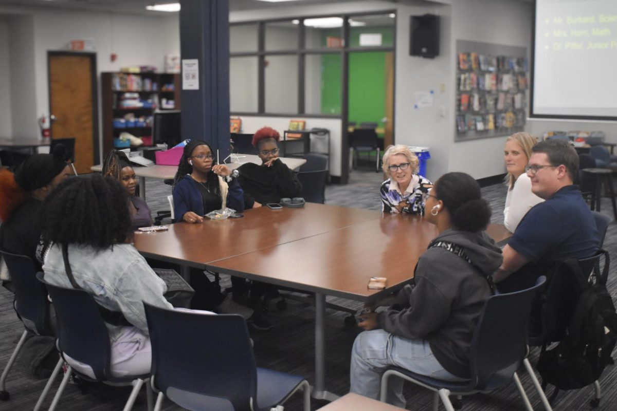 Alongside club sponsors Andrea Horn and Tim Burkard, assistant principal Kate Piffel prompts a discussion at the first Black Student Union (BSU) meeting. She accepted suggestions for BSU from members like BSU Leader and junior Tanatswa Zirengani, who moved from Zimbabwe in 2021. “Moving here and transitioning into a new school [and] lifestyle, [BSU] became [a place] where I could be myself and talk about issues that I felt comfortable talking about back home. BSU [also] gave me the opportunity to venture into the post-high-school experience, telling me [some] things to expect,” Zirengani said.