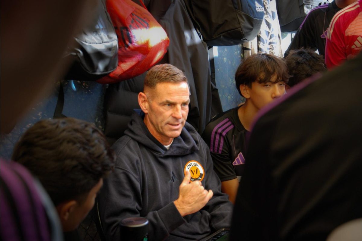 Zak Ibsen leads a team discussion, giving his advice to young athletes right before a high-level soccer game. A former professional soccer player and Olympian, Ibsen now uses his experience to mentor the next generation in MLS Next, the top level of U.S. youth soccer. “Part of his role as a coach is to develop the whole person, not just the player. Zak does a great job of helping kids learn from situations, whether they’re good or bad, and believes failure is a good chance to learn a lesson,” said Andrew Ziemer, one of Ibsen's coaching assistants.