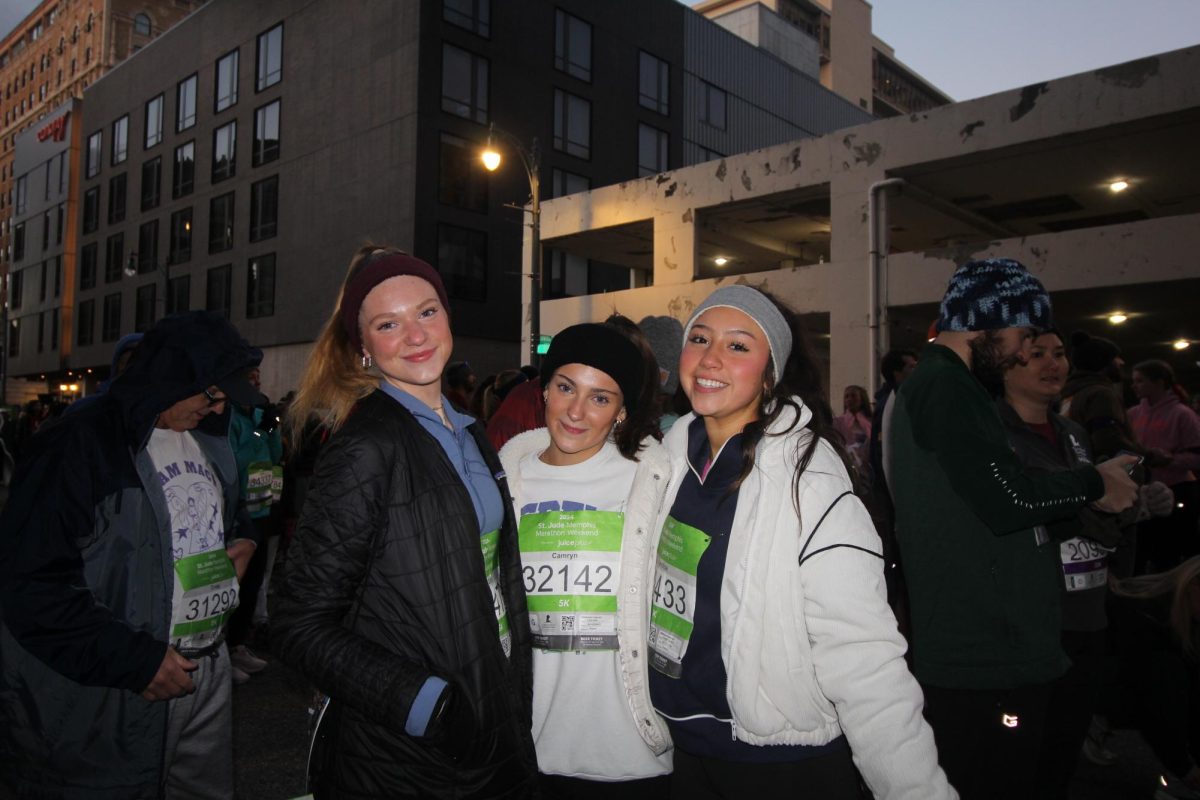  (From left to right) Sarah Scroggins (11), Lucy Roaten (11) and Karolina Deleon (11) pose for a picture before they start their 5k race on December 7th, 2024 in downtown Memphis. The 5k race took less than an hour for them. 